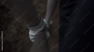 Digging a trench. Footage. Hands were digging with spades. Male hand digging with a shovel. The earth in the shovel close up