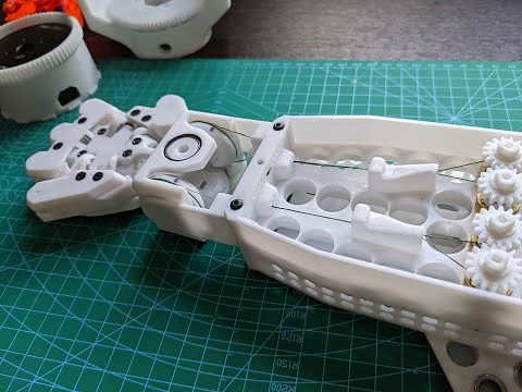 Cable driven differential wrist for robot hand