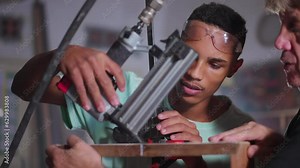 Master Carpenter Teaching Apprentice Furniture Crafting in Workshop