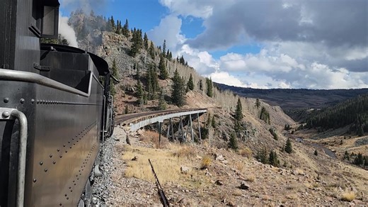 🚂💨 137 feet of air and 140 years of history — there’s nothing like the sound of a steam engine echoing through the canyon as you creep over the Cascade Creek Trestle, the highest point on the Cumbres & Toltec line. 🎥 Tristan Anderle Photography #CumbresAndToltec #SteamTrain #VisitColorado #VisitNewMexico #TrainLife #CascadeTrestle #AdventureTravel #railfanning | Cumbres & Toltec Scenic Railroad