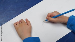 Syndactyly of the fingers: child after the operation of separation works with his/her fingers and learns to write letters on a sheet of paper