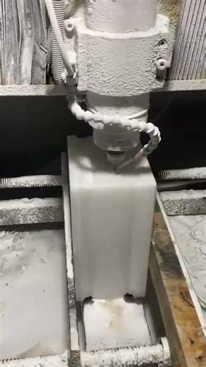 The process of perforating a line shape on a concrete wall vent using an automated machine tool.