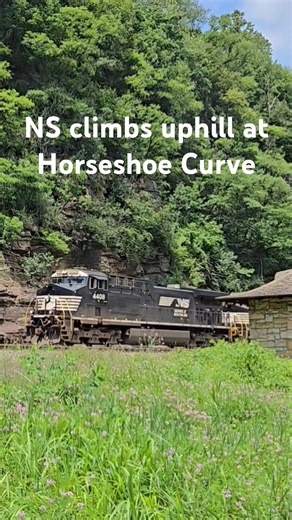 An NS stack train climbs the grade between Altoona and Gallitzin, passing through Horseshoe Curve