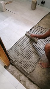 Proper Way of Applying Tile Adhesive! 🔧✨ The tile adhesive should be creamy, smooth, and workable for a flawless finish! 🌟 Check out how our expert tilers are spreading it in a perfect wavy pattern with the adhesive comb! 🧰🔨 #TileAdhesive #TilingPerfection #FloorTiling #ConstructionExpert #TilingProcess #PiumalPathirana #EngPiumalPathirana | Eng. Piumal Pathirana