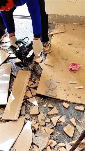 Removing Old Floor Tiles Using a Power Demolition Tool During Renovation Work #shorts