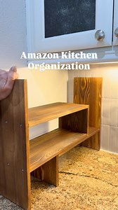 Efficient and stylish kitchen storage. This adjustable countertop shelf fits perfectly into your space—fits into corners or adjusts to the width of your space. Perfect for organizing snacks, spices, and more! A great office organizer too! #kitchenhacks #homeorganization #amazonhomefind | The Design Twins