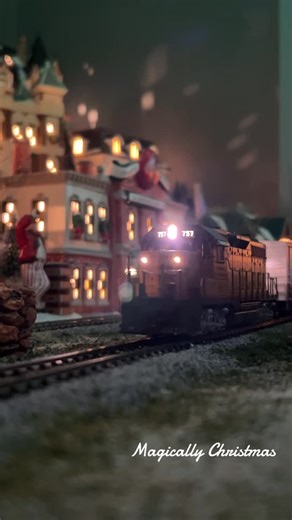 Magically Christmas on Instagram: "There’s just something magical about an HO scale train weaving through a glowing Christmas village… it’s the kind of Christmas magic that never fades. #magicallychristmas #christmas #department56 #hoscaletrains #christmasvillage"