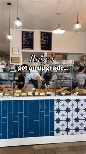 Ruby's Bakery and Cafe on Instagram: "While we were closed at the beginning of the week, we made a few upgrades… Our pastry counter now extends all the way to the wall. More space for our daily bakes! We added decorative tile to complement the blue and updated the counters to a cleaner white marble. Our takeaway fridge! Showcasing grab n’ go (or stay and enjoy) items. More variety and locally sourced house made crafts for you all to enjoy. The items stocked in the fridge will always be fresh and
