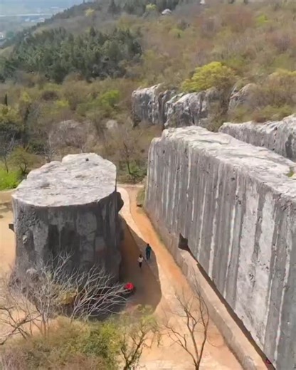 In a quiet quarry near Nanjing, three unfinished giants still lie where they were cut from the mountain. The Yangshan Monoliths were meant to become the largest stele ever erected — a single monument rising over 70 meters tall and weighing more than 30,000 tons when assembled. The base alone dwarfs modern buildings. The stele body weighs more than a navy destroyer. And yet… they were never moved. Carved during the Ming Dynasty in the early 1400s, the scale of the project defies logic. Even today