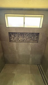 Thinking of a tiled shower niche? Here’s a simple design tip: Use a feature tile inside the niche to add visual depth and make it stand out — especially when your main wall tile is more subtle. It’s a small surface area, but the right contrast or texture here can elevate the whole bathroom. Think kit-kat mosaics, stone-look herringbone, or vertical stack tiles in a complementary tone. #BencoBathrooms #GoldCoastRenovations #BathroomDesign #bathroomremodel #bathroom #goldcoastbuilders #bathroomren