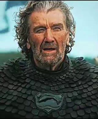 Edmure Tully is often viewed as one of the most incompetent characters in Game of Thrones. This scene captures the moment he fails to hit his father Hoster’s funeral boat with a flaming arrow multiple times.Edmure misses three times, and his sister Catelyn looks on with disdain while his nephew Robb smirks, amplifying his public humiliation.The Blackfish's intervention to take the bow and succeed in one shot without saying a word underscores his competence, experience, and the subtle contempt he