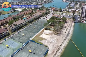 Treasure Bay Golf, Tennis & Recreation Center Living Shoreline Update ⬇️ The initial 500 feet of rip rap (large rocks) have been placed in the water. Currently, crews are cutting the top of the seawall. Once complete, they will fill in the area behind the seawall and begin shaping the land. Surveying for the reef balls, which will help create a habitat for marine life, is scheduled for the end of this week. Crews anticipate starting the installation of the reef balls shortly after. | The City of