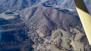 Here's a clip that just missed the cut from last weekend's YouTube video (https://youtu.be/RdE9ZDLPsvc), taken from 5,500' over Syria. The road running through town was once one of Virginia's main thoroughfares, crossing the Blue Ridge at Fishers Gap to connect the farms of the Shenandoah Valley with the markets at Fredericksburg. Bypassed long ago by better roads along easier routes through the mountains, Syria today is best known as the home to Graves Mountain Lodge and some fantastic trout fi