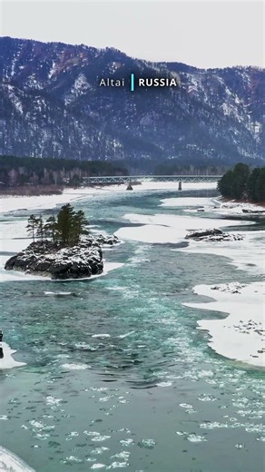 Aerial cinematic view of snow covered beautiful Altai