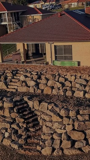 Build it once. Build it right. 🏡 This residential rock wall build creates structure, prevents erosion and boosts long-term value. Ask us how many days it took to complete this job 🤫 | Rock Walls Melbourne