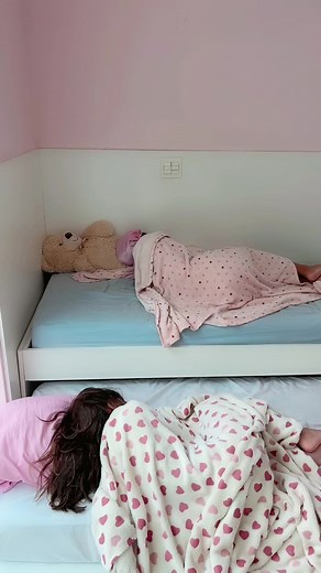 Cozy Bedroom Scene with Two Young Girls