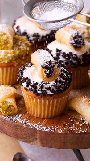 These Cannoli Cupcakes are fluffy Vanilla Cupcakes, filled with a sweet and creamy Cannoli Filling, topped with Ricotta Buttercream Frosting and decorated with a homemade mini cannoli. Full recipe: https://www.piesandtacos.com/cannoli-cupcakes/ Vanilla Cupcakes 1 1/2 cups all-purpose flour (191 g) 1 tsp baking powder 1/4 tsp baking soda 1/4 tsp fine sea salt 1/2 cup unsalted butter at room temperature (113 g) 1 cup granulated sugar (200 g) 3 large eggs at room temperature 1 tsp vanilla extract 1