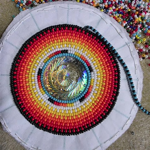 What im working on at the moment. No it dont have a spinner in the middle. AI making it come to life. Beaded medallion. #beads