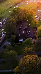 Download An aerial view of a farm with a house and trees for free