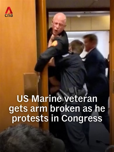 This is the moment a former US Marine had his arm broken while protesting in Congress against the ongoing war in Iran. Marine veteran Brian McGinnis shouted “No one wants to fight for Israel” as he interrupted a Senate Armed Services subcommittee hearing on Wednesday (Mar 4). The 44-year-old now faces multiple charges, police said. #usnews #usa