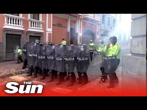 Riot police on horses clash with protesters blocking off roads in Ecuador