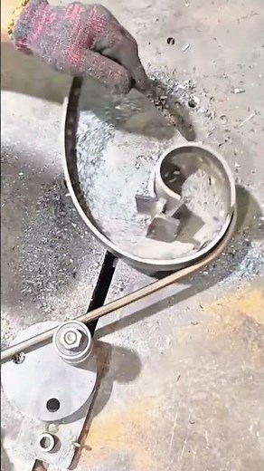 Forming elegant curved steel scroll using a manual bending jig