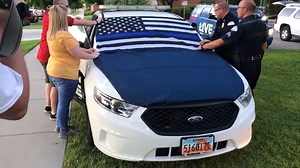 NOW: Fallen Ogden police officer's cruiser draped with a thin blue line flag. The cruiser will remain parked in front of police headquarters for the community to pay respects. [Video: Jeremy Harris] Stream 2News at 10 for live team coverage from Ogden @ kutv.com/watch | KUTV 2News