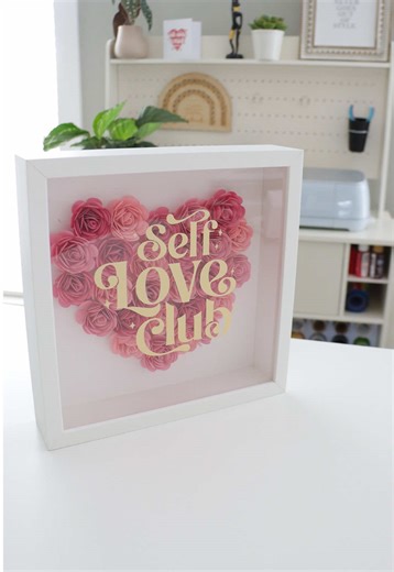 The Self Love Club shadow box is such a fun project to make with your Cricut 💕 Yes, the Venture will save you time (she’s fast 💨), but you can totally make this with a Maker, Explore, or Joy Xtra too. Fair warning though 😅shadow boxes are cute, but assembly is where the real workout happens, especially depending on the design. So my advice? Pick a shadow box you actually want to keep on display, because after all that work… it deserves a permanent spot ✨💖 #cricutmade #selfloveclub #cricutval