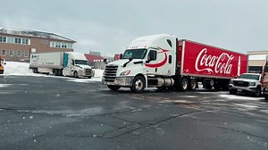 Halifax, Canada. A large semi-trailer truck with the inscription Coca Cola leaves after unloading a drink at a restaurant. 7. March. 2023. Coca Cola Truck (Coke) on the street. Coca-Cola