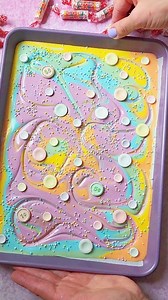 Smarties Chocolate Bark 🍭🍫 Would you make it for St.Patrick's Day?🌈 Ingredients: White Chocolate, melted Oil-Based Food Coloring Gels Pastel Rainbow Nonpareils Smarties Directions: Divide the melted white chocolate into separate bowls, quantity is according to how many colors you'd like to use. Add and mix in the oil-based food coloring gels. (I used white, neon yellow, orange, green, blue, purple). Line a baking pan with parchment paper. Pour in the white chocolate first, followed by the col