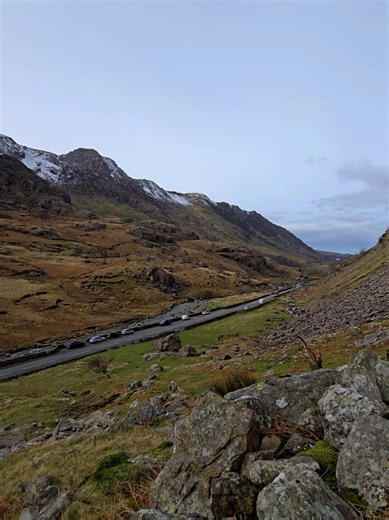 Hiking Pen-y-Pass in Eryri (Snowdonia) National Park after snowfall on the mountains. The views are just breathtaking, being able to sit here and relax and admire the scenery is a must. Enjoy your visit. #hiking #penypass #eryri #snowdonia #northwales