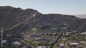 Luxurious wealthy mansions on the hills of Mummy Mountain in Paradise Valley of Arizona, USA. Aerial shot.