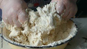 the cook is kneading the dough. healthy food concept