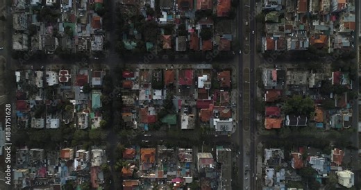 Aerial view of a residential area with organized streets and houses in a grid pattern with red and grey roofs, Maputo, Maputo, Mozambique.