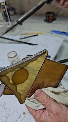 5.1K views · 64 reactions | Double glass + pronounced texture = a real challenge! 﫣 Even when the glasses don't fit tightly, the seam must be flawless. The secret? Carefully add solder without overheating the glass and smooth the edge. Patience and precision work wonders! #SantasHouse141118 #StainedGlass #GlassArt #TexturedGlass #Soldering #CraftingTips #AGlassStudio #DIYCrafts #DoubleGlass | AAGlassStudios Stained Glass Pattern | Facebook