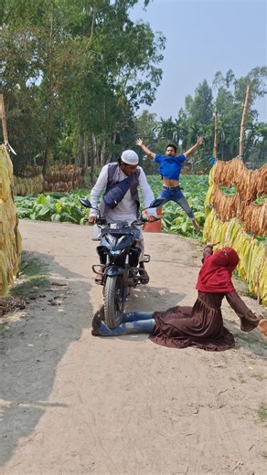 A beggar woman sits on the street wearing fake legs in disguise.
