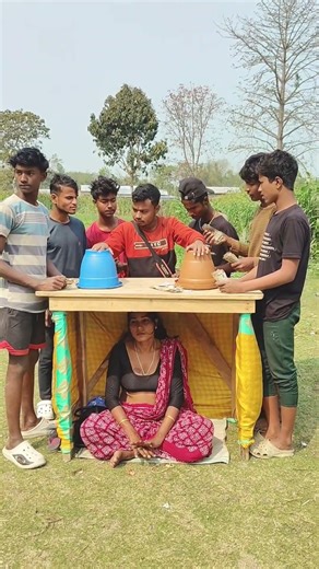 The girl is sitting under the table, raking in money, and heading home.