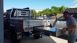 The lift up bench on our under tray ute drawers is a handy table top. | Dunn & Watson Pty Ltd
