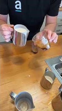 Demonstrating how to pour the heart pattern in a latte