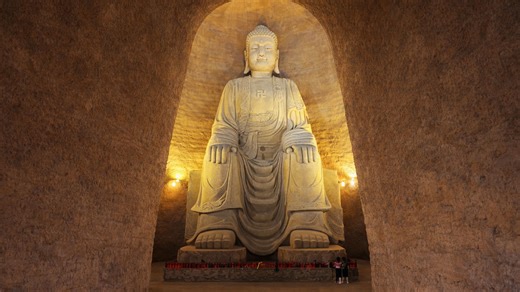 This Buddha in China looks calm but towers up close