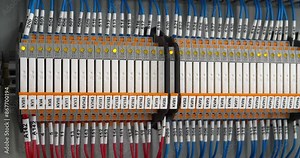 Terminal blocks in electrical cabinet. Industrial electrical equipment and wiring. Terminal blocks for electrical connection, electrical panel at a assembly with number tag equipment