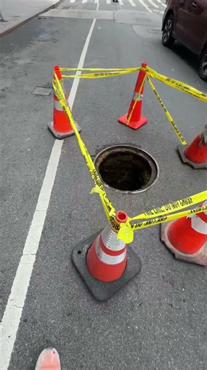 Open manhole cover in NYC - Chelsea