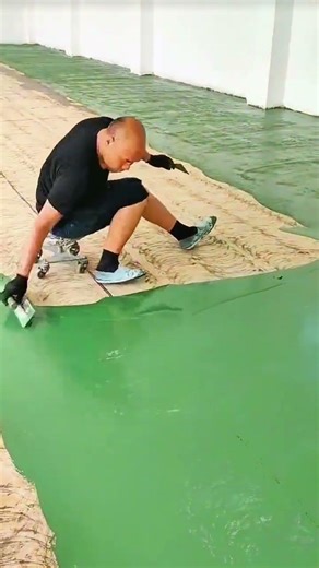 "Floor coating process shows accurate renovation work technique