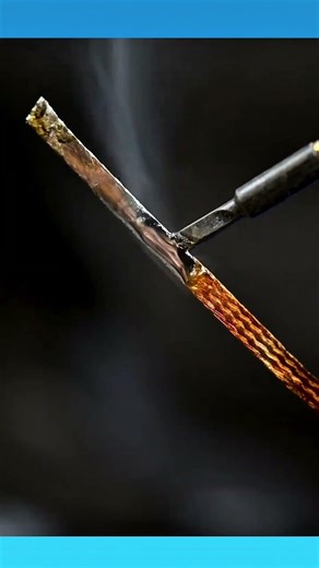 Soldering a cable connection onto a computer component, creating a precise, secure electrical joint.