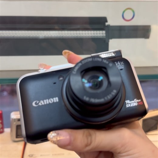 The digicamhub on Instagram: "Canon Powershot SX230 HS The same viral camera that gives THAT warm, dreamy sunset glow 🌺💛 Rare + high demand Great condition (minor screen darkening) No affect on photos •You get charger + memory card •Extra add-ons - phone charm, memorycard reader are chargeable •₹13,000 + shipping (Slightly negotiatable) DM before it’s gone 🔥 . . Follow @digicam.hub to unlock early bird discounts 😍✨ . . (Viral sunset, digital camera, canon g7x mark