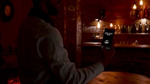 Barista uses innovative app to turn on bar lights - Free Stock Video