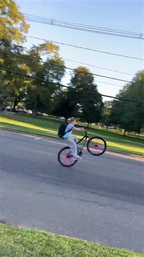 Kid popping wheelies in the middle of the street in Guilford, CT #cyclekids #parenting #kidsonbikes