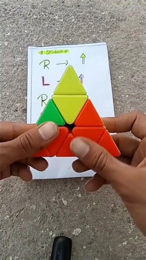 How to solve pyraminx cube in the magic tricks #how #puzzle #pyraminxcube#viralshort