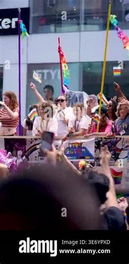 Children and families cheer and wave rainbow flags during a Pride parade in downtown Toronto. The scene captures community spirit, inclusivity, and support for LGBTQ culture in a vibrant urban setting. Toronto Canada - June 30, 2024 Stock Video Footage - Alamy