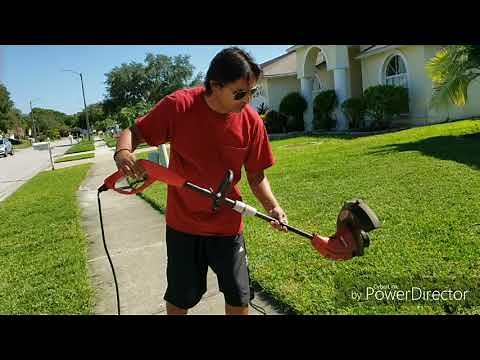 Edging the lawn with a homelite trimmer.